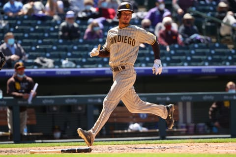 DENVER, CO – MAY 12: Tucupita Marcano #16 of the San Diego Padres scores on a bunt single against the Colorado Rockies during game one of a doubleheader at Coors Field on May 12, 2021 in Denver, Colorado. (Photo by Jamie Schwaberow/Getty Images)