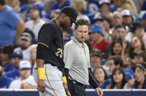 TORONTO, ON – AUGUST 12: Gregory Polanco #25 of the Pittsburgh Pirates exits the game with a leg injury as he is assisted by the trainer in the fifth inning during MLB game action against the Toronto Blue Jays at Rogers Centre on August 12, 2017 in Toronto, Canada. (Photo by Tom Szczerbowski/Getty Images)