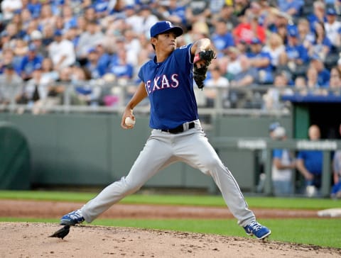 May 14, 2019; Kansas City, MO, USA; Texas Rangers relief pitcher Wei-Chieh Huang (68) delivers a pitch as a bird walks on the mound in the second inning against the Kansas City Royals at Kauffman Stadium. Mandatory Credit: Denny Medley-USA TODAY Sports