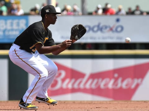 Mar 9, 2020; Bradenton, Florida, USA; Pittsburgh Pirates infielder Ke’Bryan Hayes (13) fields a ground ball in the second inning against the Toronto Blue Jays at LECOM Park. Mandatory Credit: Jonathan Dyer-USA TODAY Sports