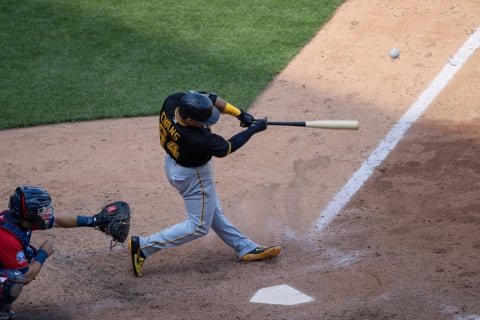 Aug 4, 2020; Minneapolis, Minnesota, USA; Pittsburgh Pirates third baseman Phillip Evans (64) hits a RBI single during the ninth inning against the Minnesota Twins at Target Field. Mandatory Credit: Jordan Johnson-USA TODAY Sports