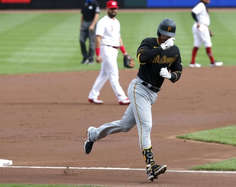 Aug 13, 2020; Cincinnati, Ohio, USA; Pittsburgh Pirates third baseman Colin Moran (19) reacts as he rounds third base after hitting a solo home run against the Cincinnati Redsduring the first inning at Great American Ball Park. Mandatory Credit: David Kohl-USA TODAY Sports