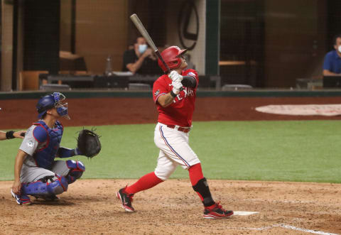 Aug 29, 2020; Arlington, Texas, USA; Texas Rangers left fielder Shin-Soo Choo hits a sacrifice fly during the fifth inning against the Los Angeles Dodgers at Globe Life Field. Mandatory Credit: Kevin Jairaj-USA TODAY Sports