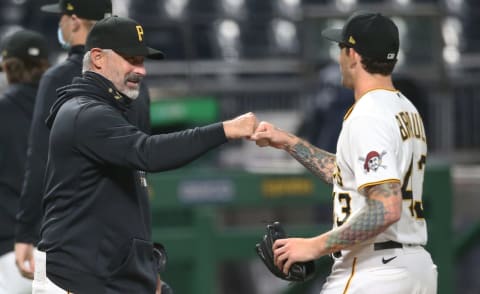 Sep 17, 2020; Pittsburgh, Pennsylvania, USA; Pittsburgh Pirates manager Derek Shelton (left) congratulates starting pitcher Steven Brault (43) on his complete game victory over the St. Louis Cardinals at PNC Park. Pittsburgh won 5-1. Mandatory Credit: Charles LeClaire-USA TODAY Sports