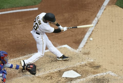 Sep 24, 2020; Pittsburgh, Pennsylvania, USA; Pittsburgh Pirates left fielder Jared Oliva (76) singles against the Chicago Cubs during the fourth inning at PNC Park. Mandatory Credit: Charles LeClaire-USA TODAY Sports