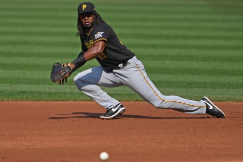 Sep 27, 2020; Cleveland, Ohio, USA; Pittsburgh Pirates first basemen Josh Bell (55) fields the ball during the first inning against the Cleveland Indians at Progressive Field. Mandatory Credit: David Dermer-USA TODAY Sports