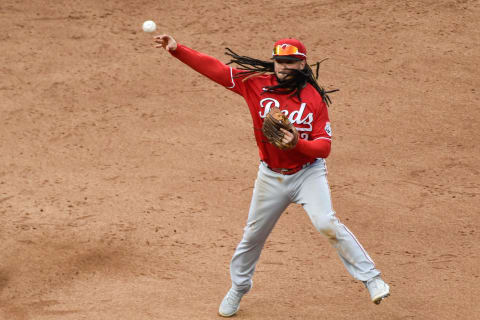 Sep 27, 2020; Minneapolis, Minnesota, USA; Cincinnati Reds shortstop Freddy Galvis (3) turns the second half of a double play off the bat of Minnesota Twins designated hitter Nelson Cruz (23) during the eighth inning at Target Field. Mandatory Credit: Jeffrey Becker-USA TODAY Sports