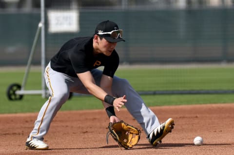 Feb 24, 2021; Bradenton, Florida, USA; Pittsburgh Pirates infielder Ji-Hwan Bae (90) fields the ball during spring training at Pirate City. Mandatory Credit: Jonathan Dyer-USA TODAY Sports