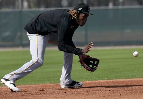 Feb 24, 2021; Bradenton, Florida, USA; Pittsburgh Pirates infielder Oneil Cruz (61) fields the ball during spring training at Pirate City. Mandatory Credit: Jonathan Dyer-USA TODAY Sports