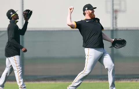 Feb 24, 2021; Bradenton, Florida, USA; Pittsburgh Pirates infielder Colin Moran (19) warms up during spring training at Pirate City. Mandatory Credit: Jonathan Dyer-USA TODAY Sports