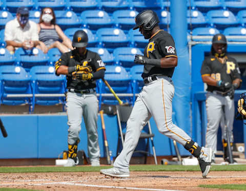 Mar 1, 2021; Dunedin, Florida, USA; Pittsburgh Pirates Anthony Alford (8) steps on home after hitting a home run against the Toronto Blue Jays in the top of the second during spring training at TD Ballpark. Mandatory Credit: Nathan Ray Seebeck-USA TODAY Sports