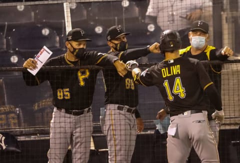 Mar 10, 2021; Tampa, Florida, USA; Pittsburgh Pirates right fielder Jared Oliva (14) celebrates with the bench after hitting a home run in the sixth inning during spring training at George M. Steinbrenner Field. Mandatory Credit: Nathan Ray Seebeck-USA TODAY Sports