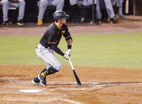 Mar 10, 2021; Tampa, Florida, USA; Pittsburgh Pirates right fielder Jared Oliva (14) looks up after hitting a home run in the sixth inning during spring training at George M. Steinbrenner Field. Mandatory Credit: Nathan Ray Seebeck-USA TODAY Sports