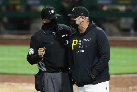 Apr 13, 2021; Pittsburgh, Pennsylvania, USA; Home plate umpire Vic Carapazza (L) talks with Pittsburgh Pirates manager Derek Shelton (R) after both benches were warned during the eighth inning at PNC Park. Mandatory Credit: Charles LeClaire-USA TODAY Sports