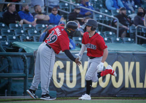 Indianapolis center fielder Travis Swaggerty, right, celebrates after hitting a home run in the first inning off Iowa starting pitcher Joe Biagini at Principal Park in Des Moines on Tuesday, May 4, 2021.20210504 Iowacubs