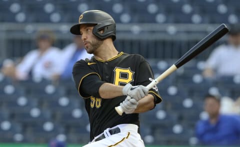 May 25, 2021; Pittsburgh, Pennsylvania, USA; Pittsburgh Pirates catcher Jacob Stallings (58) hits an RBI single against the Chicago Cubs during the first inning at PNC Park. Mandatory Credit: Charles LeClaire-USA TODAY Sports