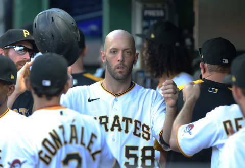 Jun 5, 2021; Pittsburgh, Pennsylvania, USA; Pittsburgh Pirates catcher Jacob Stallings (58) high-fives in the dugout after scoring a run against the Miami Marlins during the tenth inning at PNC Park. Pittsburgh won 8-7 in twelve innings. Mandatory Credit: Charles LeClaire-USA TODAY Sports