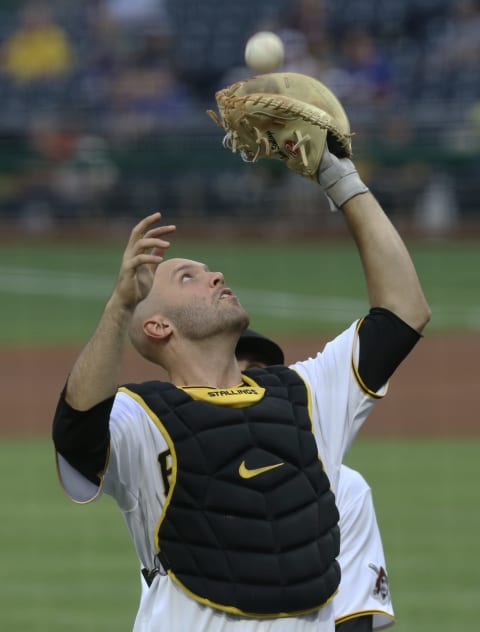 Jun 8, 2021; Pittsburgh, Pennsylvania, USA; Pittsburgh Pirates catcher Jacob Stallings (58) makes a catch on a pop-up for an out against the Los Angeles Dodgers during the first inning at PNC Park. Mandatory Credit: Charles LeClaire-USA TODAY Sports