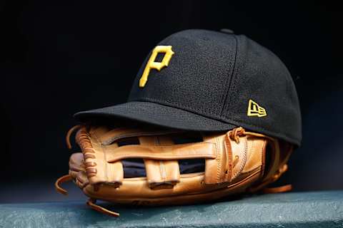 Jun 30, 2021; Denver, Colorado, USA; A general view of a Pittsburgh Pirates glove and hat in the eighth inning against the Colorado Rockies at Coors Field. Mandatory Credit: Isaiah J. Downing-USA TODAY Sports