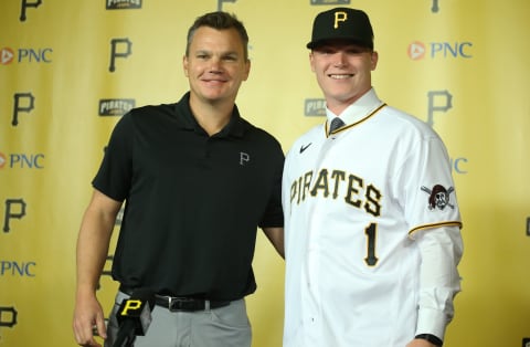 Jul 18, 2021; Pittsburgh, Pennsylvania, USA; Pittsburgh Pirates general manager Ben Cherington (left) introduces catcher Henry Davis (right) who was selected number one overall in the 2021 MLB first year player draft by the Pirates at a news conference before the Pirates play the New York Mets at PNC Park. Mandatory Credit: Charles LeClaire-USA TODAY Sports