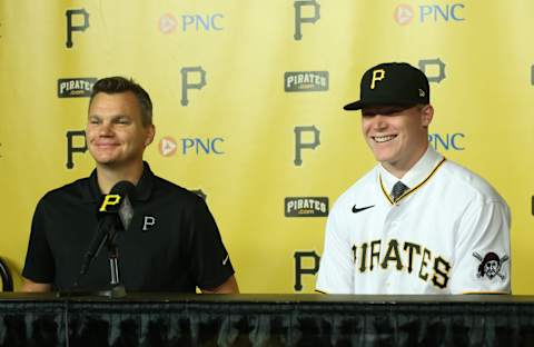 Jul 18, 2021; Pittsburgh, Pennsylvania, USA; Pittsburgh Pirates general manager Ben Cherington (left) introduces catcher Henry Davis (right) who was selected number one overall in the 2021 MLB first year player draft by the Pirates at a news conference before the Pirates play the New York Mets at PNC Park. Mandatory Credit: Charles LeClaire-USA TODAY Sports