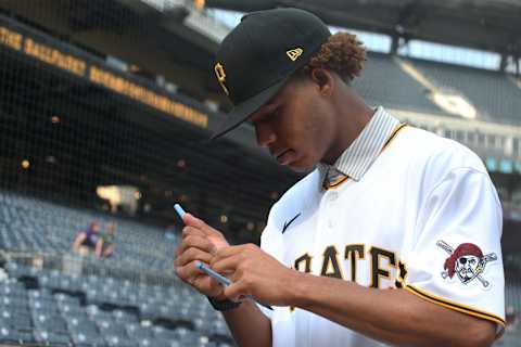 Jul 27, 2021; Pittsburgh, Pennsylvania, USA; Pittsburgh Pirates outfielder Braylon Bishop who was the Pirates 14th round pick in the 2021 first year player draft signs an autograph before the Pirates play the Milwaukee Brewers at PNC Park. Mandatory Credit: Charles LeClaire-USA TODAY Sports