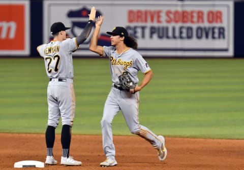 Sep 18, 2021; Miami, Florida, USA; Pittsburgh Pirates outfielder Cole Tucker (3) celebrates with shortstop Kevin Newman (27) after defeating the Miami Marlins at loanDepot Park. Mandatory Credit: Jim Rassol-USA TODAY Sports