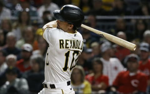 Oct 2, 2021; Pittsburgh, Pennsylvania, USA; Pittsburgh Pirates center fielder Bryan Reynolds (10) hits an RBI triple against the Cincinnati Reds during the sixth inning at PNC Park. The Pirates won 8-6. Mandatory Credit: Charles LeClaire-USA TODAY Sports