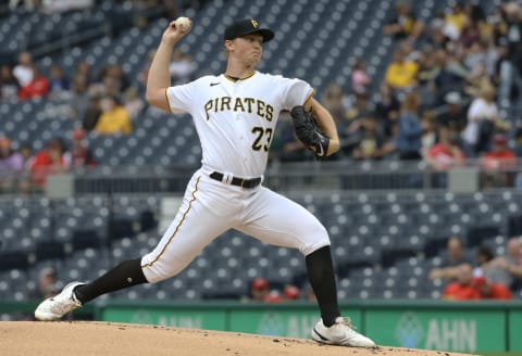 Oct 3, 2021; Pittsburgh, Pennsylvania, USA; Pittsburgh Pirates starting pitcher Mitch Keller (23) delivers a pitch against the Cincinnati Reds during the first inning at PNC Park. Mandatory Credit: Charles LeClaire-USA TODAY Sports