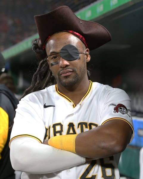 Oct 4, 2022; Pittsburgh, Pennsylvania, USA; Pittsburgh Pirates designated hitter Miguel Andujar (26) wears a Pirate costume in the dugout against the St. Louis Cardinals during the third inning at PNC Park. Mandatory Credit: Charles LeClaire-USA TODAY Sports