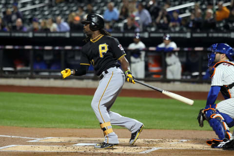 September 25, 2012; New York, NY, USA; Pittsburgh Pirates center fielder Andrew McCutchen (22) hits a double during the first inning of a game against the New York Mets at Citi Field. Mandatory Credit: Brad Penner-USA TODAY Sports