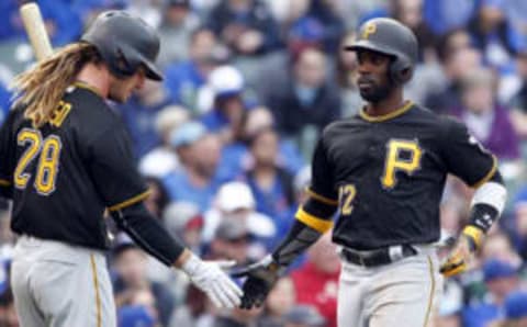 Apr 14, 2017; Chicago, IL, USA; Pittsburgh Pirates relief pitcher Juan Nicasio (12) celebrates with first baseman John Jaso (28) after scoring during the sixth inning of the game against the Chicago Cubs at Wrigley Field. Mandatory Credit: Caylor Arnold-USA TODAY Sports