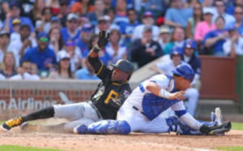 Apr 16, 2017; Chicago, IL, USA; Pittsburgh Pirates shortstop Alen Hanson (37) slides in safely at home with Chicago Cubs catcher Willson Contreras (40) taking the throw during the eighth inning at Wrigley Field. Mandatory Credit: Dennis Wierzbicki-USA TODAY Sports