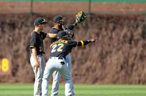 Apr 16, 2017; Chicago, IL, USA; Pittsburgh Pirates left fielder Adam Frazier (26) and center fielder Starling Marte (6) and right fielder Andrew McCutchen (22) point to the right field bleachers following the ninth inning against the Chicago Cubs at Wrigley Field. Pittsburgh won 6-1. Mandatory Credit: Dennis Wierzbicki-USA TODAY Sports