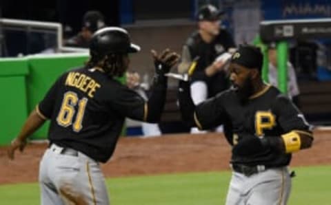 Apr 28, 2017; Miami, FL, USA; Pittsburgh Pirates second baseman Gift Ngoepe (left) and Pirates third baseman Josh Harrison (right) react after scoring runs during the second inning against the Miami Marlins at Marlins Park. Mandatory Credit: Steve Mitchell-USA TODAY Sports