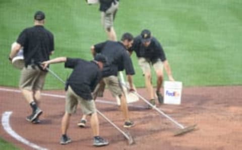 May 31, 2017; Pittsburgh, PA, USA; The Pittsburgh Pirates ground crew works on the field between the half inning against the Arizona Diamondbacks during the eleventh inning at PNC Park. Mandatory Credit: Charles LeClaire-USA TODAY Sports