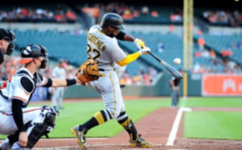 Jun 6, 2017; Baltimore, MD, USA; Pittsburgh Pirates outfielder Andrew McCutchen (22) hits an RBI single in the second inning against the Baltimore Orioles at Oriole Park at Camden Yards. Mandatory Credit: Evan Habeeb-USA TODAY Sports