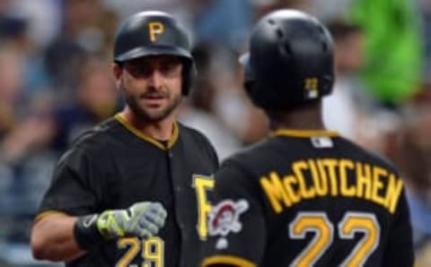 Apr 19, 2016; San Diego, CA, USA; Pittsburgh Pirates catcher Francisco Cervelli (29) congratulates center fielder Andrew McCutchen (22) after McCutchen scored during the first inning against the San Diego Padres at Petco Park. Mandatory Credit: Jake Roth-USA TODAY Sports