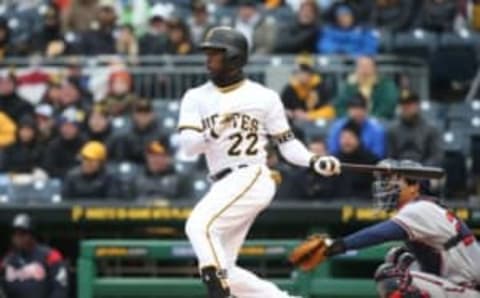 Apr 7, 2017; Pittsburgh, PA, USA; Pittsburgh Pirates right fielder Andrew McCutchen (22) singles against the Atlanta Braves during the first inning in the 2017 season opening home game at PNC Park. Mandatory Credit: Charles LeClaire-USA TODAY Sports