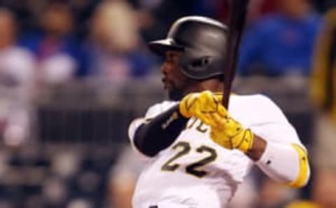 Sep 27, 2016; Pittsburgh, PA, USA; Pittsburgh Pirates center fielder Andrew McCutchen (22) hits a two run single against the Chicago Cubs during the ninth inning at PNC Park. The Cubs won 6-4. Mandatory Credit: Charles LeClaire-USA TODAY Sports