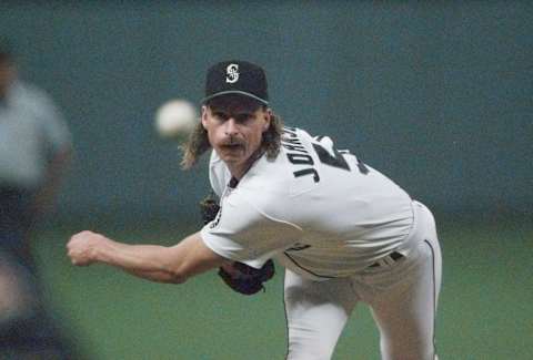 Seattle Mariner pitcher Randy Johnson throws against the Cleveland Indians in the first inning of game six of the ALCS in Seattle Tuesday, Oct. 17, 1995. (AP Photo/ Elaine Thompson)