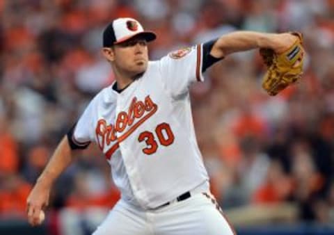 Oct 2, 2014; Baltimore, MD, USA; Baltimore Orioles starting pitcher Chris Tillman (30) pitches during the first inning in game one of the 2014 American League divisional series against the Detroit Tigers at Oriole Park at Camden Yards.Mandatory Credit: Tommy Gilligan-USA TODAY Sports