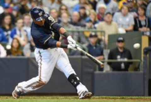 May 31, 2015; Milwaukee, WI, USA; Milwaukee Brewers shortstop Jean Segura (9) drives in a run with a base hit in the sixth inning against the Arizona Diamondbacks at Miller Park. Mandatory Credit: Benny Sieu-USA TODAY Sports