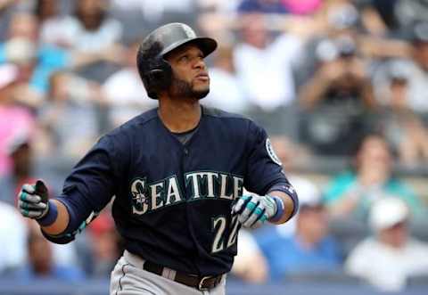 Jul 18, 2015; Bronx, NY, USA; Seattle Mariners second baseman Robinson Cano (22) watches his two-run home run against the New York Yankees during the sixth inning at Yankee Stadium. Mandatory Credit: Adam Hunger-USA TODAY Sports