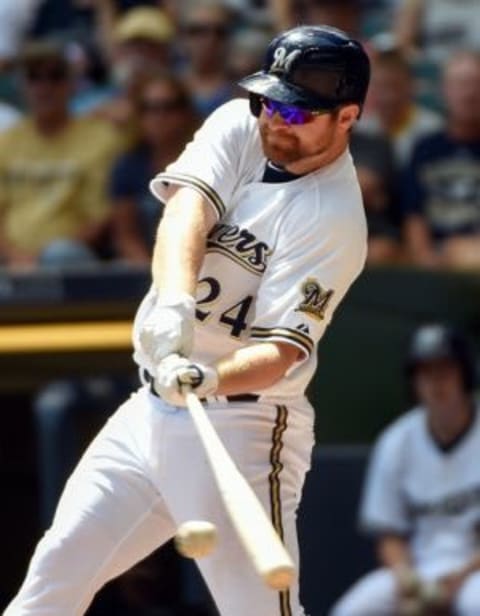 Jul 22, 2015; Milwaukee, WI, USA; Milwaukee Brewers first baseman Adam Lind (24) drives in a run with a base hit in the second inning against the Cleveland Indians at Miller Park. Mandatory Credit: Benny Sieu-USA TODAY Sports