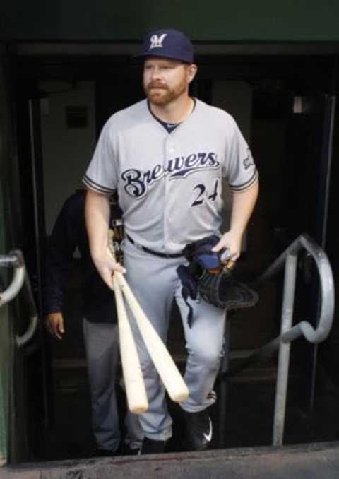 Jun 8, 2015; Pittsburgh, PA, USA; Milwaukee Brewers first baseman Adam Lind (24) enters the dugout before playing the Pittsburgh Pirates at PNC Park. Mandatory Credit: Charles LeClaire-USA TODAY Sports