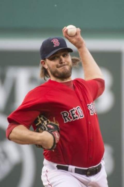 Jun 5, 2015; Boston, MA, USA; Boston Red Sox pitcher Wade Miley (20) delivers a pitch during the first inning of the game against the Oakland Athletics at Fenway Park. Mandatory Credit: Gregory J. Fisher-USA TODAY Sports