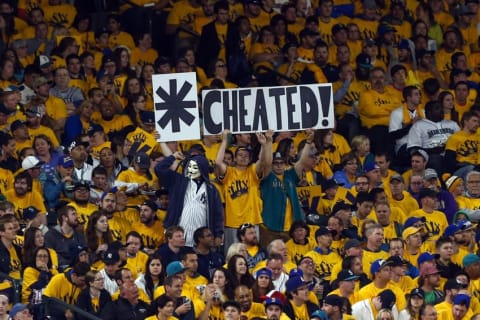 Jun 1, 2015; Seattle, WA, USA; Seattle Mariners fans hold signs referring to a steroid suspension last season of New York Yankees designated hitter Alex Rodriguez (not pictured) during the fifth inning at Safeco Field. Mandatory Credit: Joe Nicholson-USA TODAY Sports