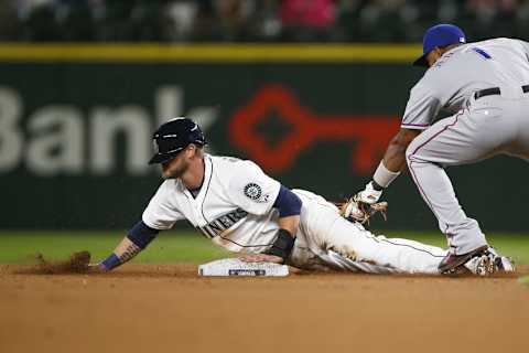 Sep 9, 2015; Seattle, WA, USA; Seattle Mariners right fielder Shawn O Malley (36) steals a base against the Texas Rangers during the seventh inning at Safeco Field. Mandatory Credit: Joe Nicholson-USA TODAY Sports