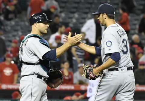 April 22, 2016; Anaheim, CA, USA; Seattle Mariners relief pitcher Steve Cishek (31) and catcher Chris Iannetta (33) celebrate the 5-2 victory against Los Angeles Angels at Angel Stadium of Anaheim. Mandatory Credit: Richard Mackson-USA TODAY Sports